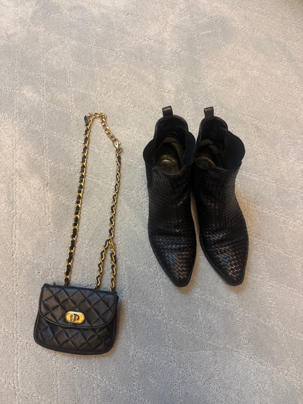 Black leather ankle boots and wallet belt.